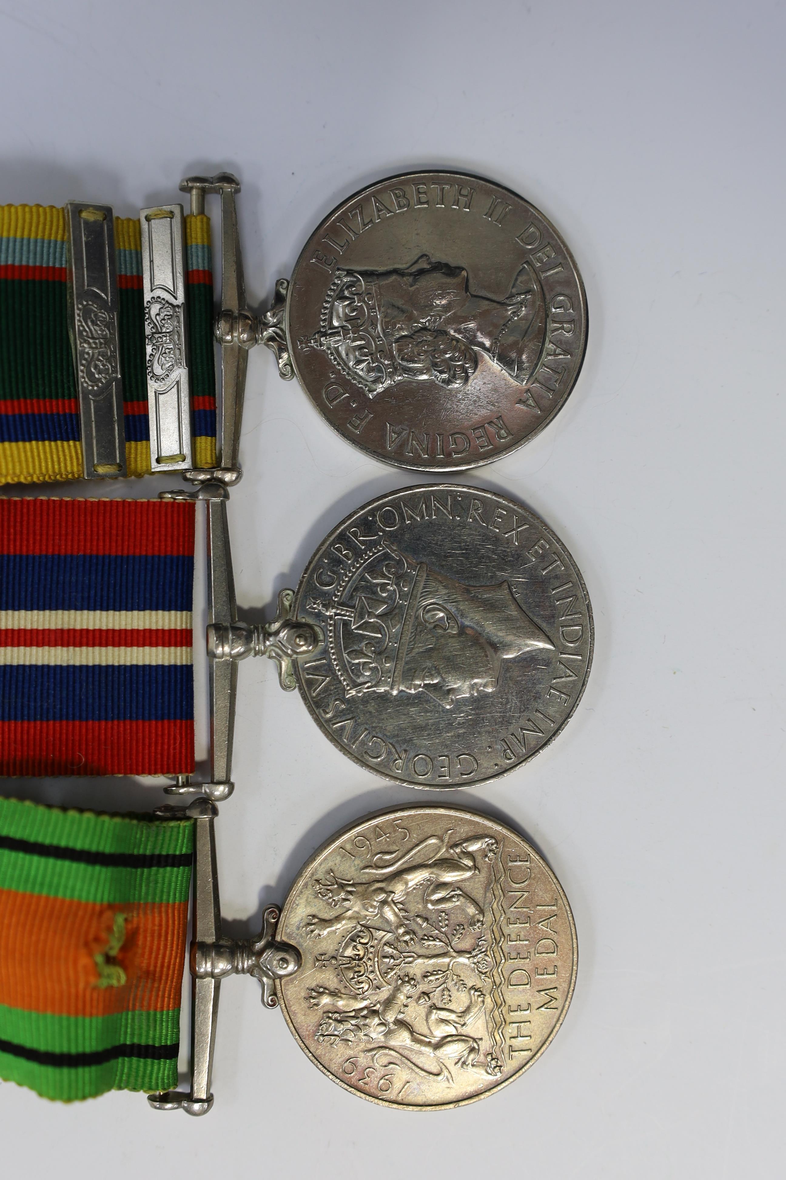 A group of assorted medals; WW2/ERII Cadet Forces medal group of 3 with two clasps to Fg.Off.W.K.Winstone R.A.F.V.R.(T); ERII RAFLSGC to Cpl B.K.Stockwell (F2570477) in box; WW2 Dm & WM. Condition - fair to good.